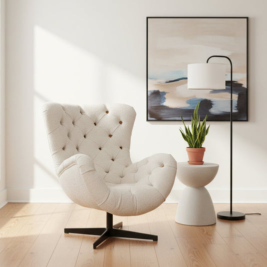 Vintage Sofa Company Sevilla Deep Buttoned, 360 Degree Swivel Chair in a plush cream upholstery with black metal base