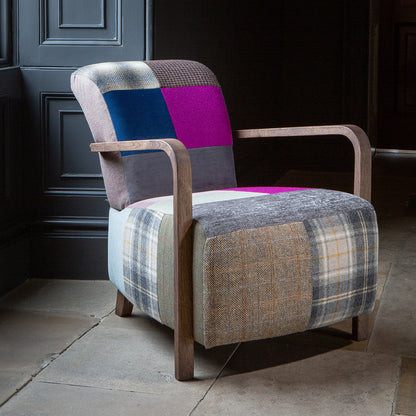 Vintage Sofa Company Shaun Patchwork Accent Chair with Antique wooden arms features a generously sized seat with a mix of checks, plains and textured patterns
