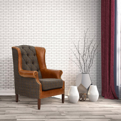Vintage Sofa Company Wing Armchair in Moreland Fabric and leather, with deep button tufting to the back rest, with a wing back design and scrolled arms 