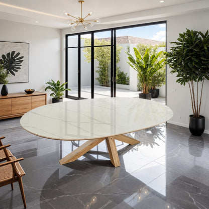 Carlton Furniture Barkington Sintered Stone Dining Table - styled room view of pale oval sintered-stone top and wooden spider base
