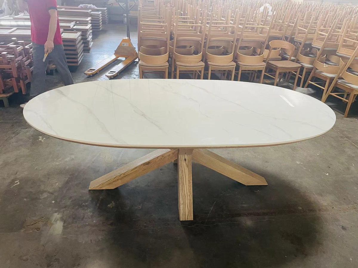 Carlton Furniture Barkington Sintered Stone Dining Table - front factory view of pale oval table