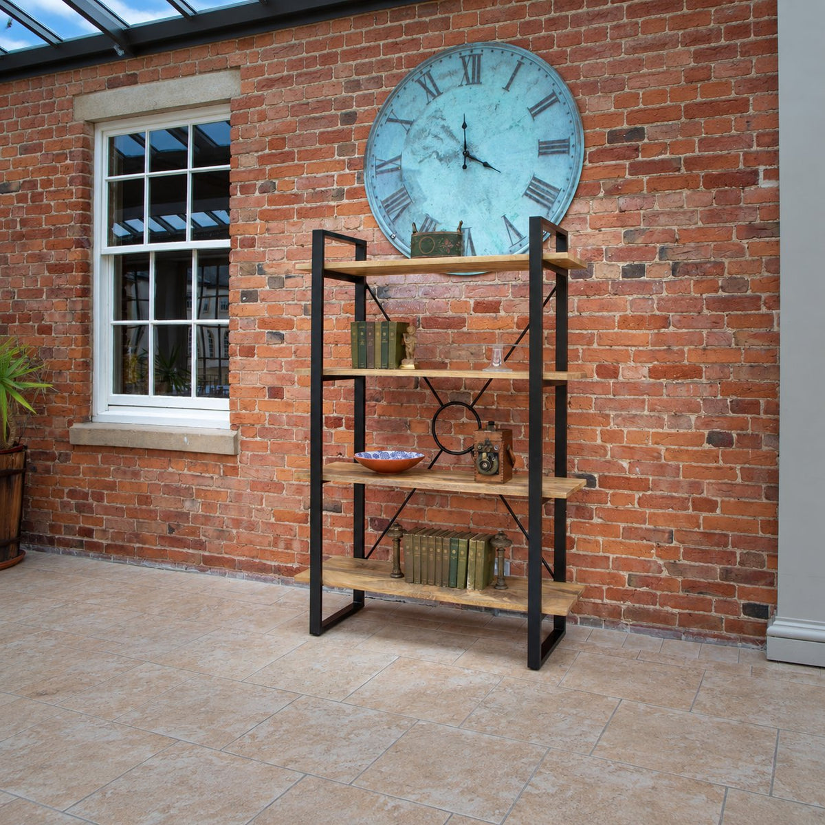 Carlton Furniture Fluted Line X-O Metal Bookcase - room view of wooden shelves and black metal frame against a brick wall