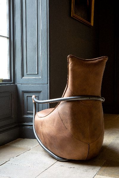 Carlton Furniture Maverick Retro Relax Armchair - side room view showing curved frame and round base