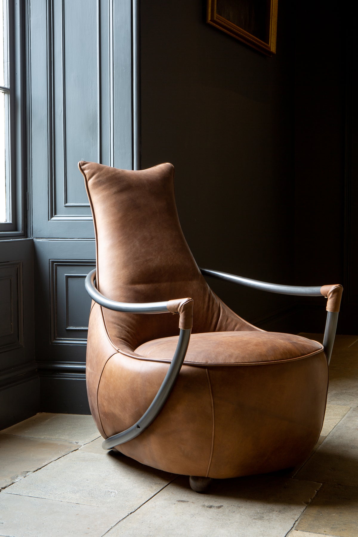 Carlton Furniture Maverick Retro Relax Armchair - angled room view of warm brown relax chair and curved frame