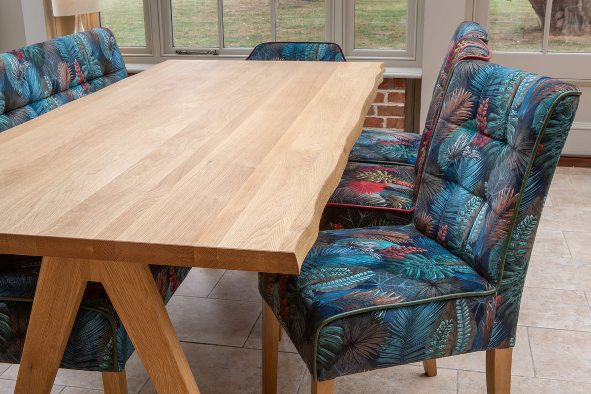 Carlton Furniture Modena Dining Table with A Shape Wooden Legs in Natural Oiled - close room view of tabletop and seating