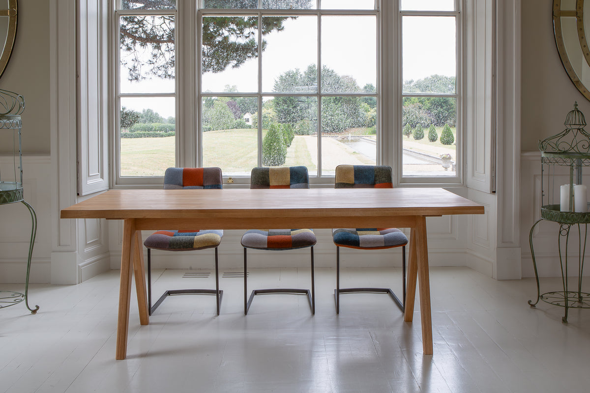 Carlton Furniture Modena Dining Table with A Shape Wooden Legs in Natural Oiled - room view of natural-oiled top and wooden A legs