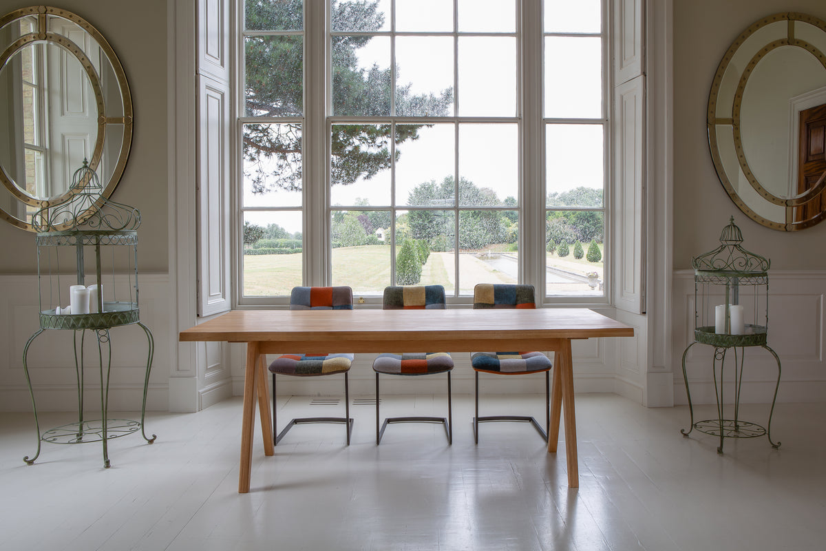 Carlton Furniture Modena Dining Table with A Shape Wooden Legs in Natural Oiled - room view of natural-oiled top and wooden A legs