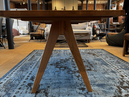 Carlton Furniture Modena Dining Table with A Shape Wooden Legs in Natural Oiled - showroom side view of wooden A leg