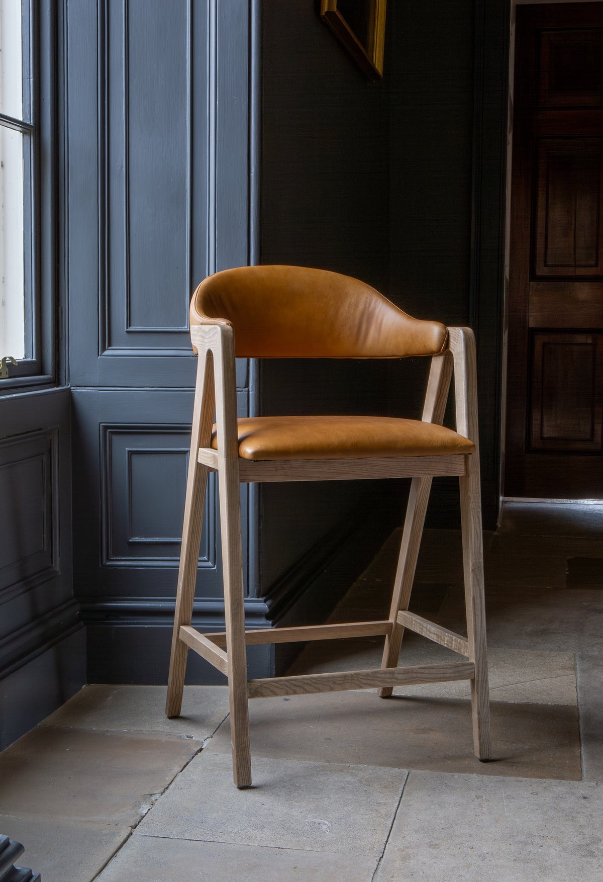 Carlton Furniture Ossby Barstool with Crossrail Tan Leather Grey Oiled Finish — lifestyle setting