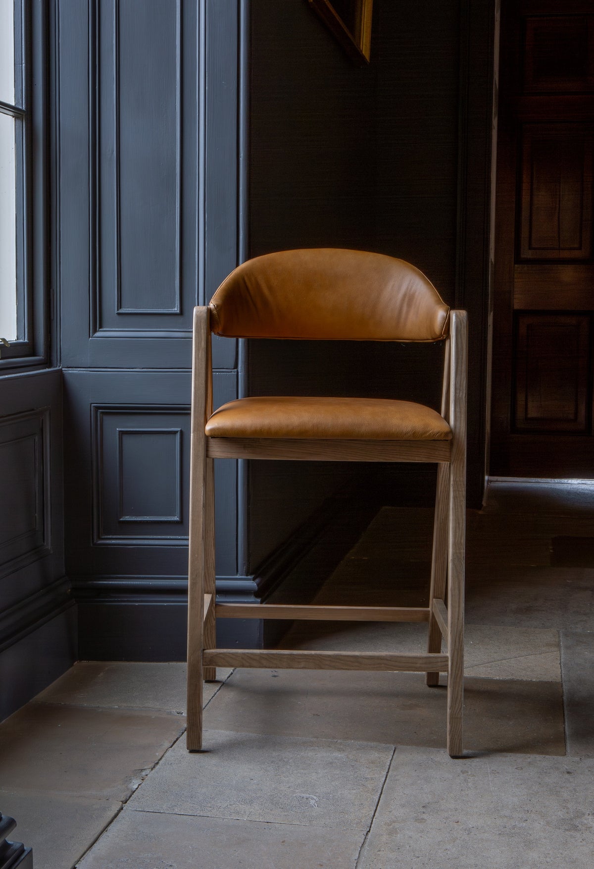Carlton Furniture Ossby Barstool with Crossrail Tan Leather Grey Oiled Finish — lifestyle setting