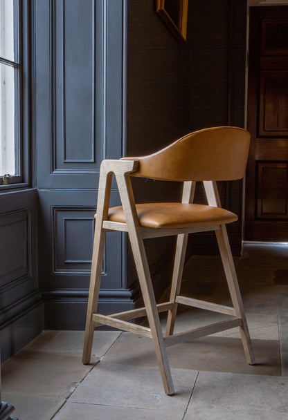 Carlton Furniture Ossby Barstool with Crossrail Tan Leather Grey Oiled Finish — lifestyle setting