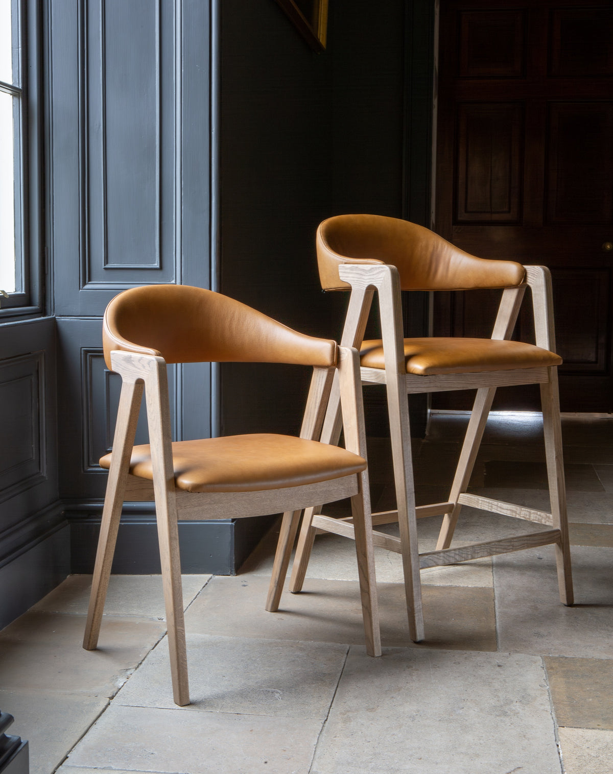 Carlton Furniture Ossby Barstool with Crossrail Tan Leather Grey Oiled Finish — lifestyle setting