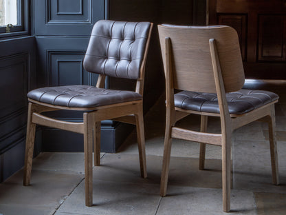 Carlton Furniture Pair of Boden Chairs upholstered seat and back in Grey Leather Grey oil legs — lifestyle setting
