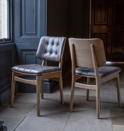 Carlton Furniture Pair of Boden Chairs upholstered seat and back in Grey Leather Grey oil legs — lifestyle setting