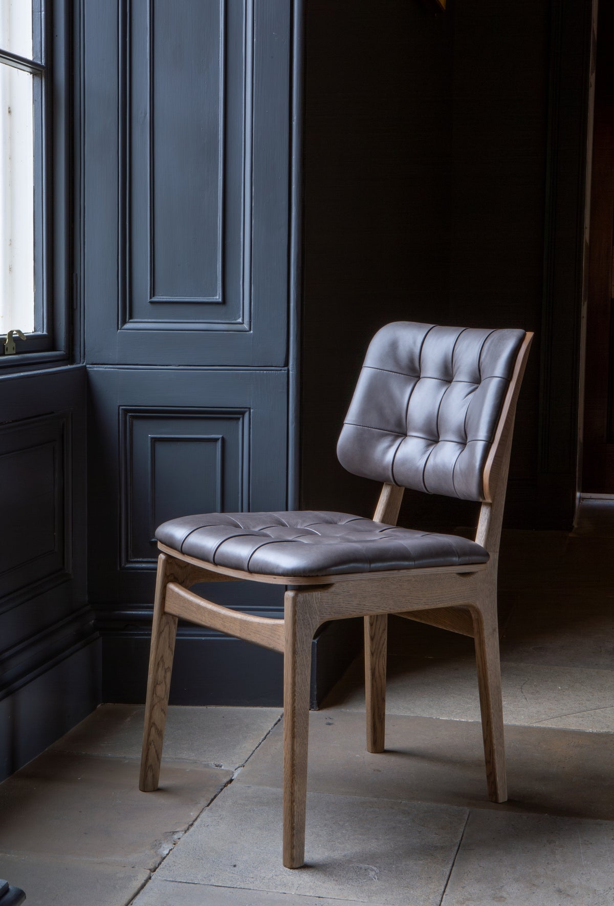 Carlton Furniture Pair of Boden Chairs upholstered seat and back in Grey Leather Grey oil legs — lifestyle setting