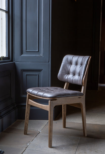 Carlton Furniture Pair of Boden Chairs upholstered seat and back in Grey Leather Grey oil legs — lifestyle setting