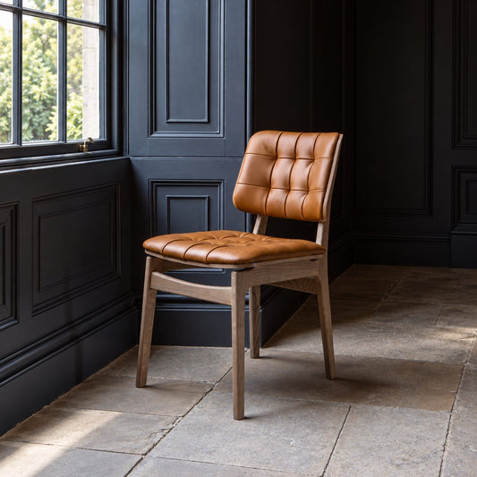 Carlton Furniture Pair of Boden Chairs upholstered seat and back in Tan Leather Grey oil legs — lifestyle setting