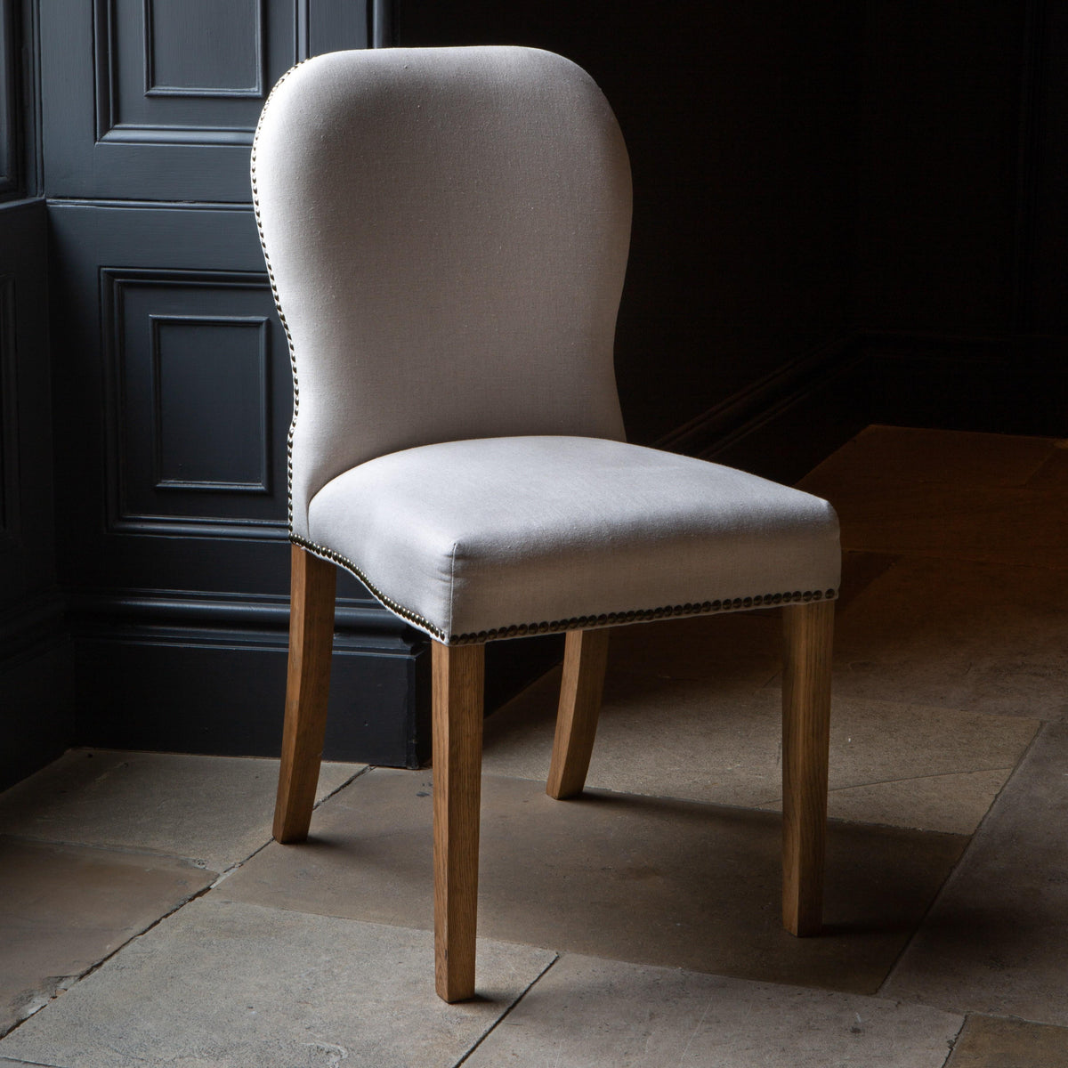 Carlton Furniture Pair of Pavilion Dining Chairs - Natural Linen Grey oil legs & Brass Studs — lifestyle setting
