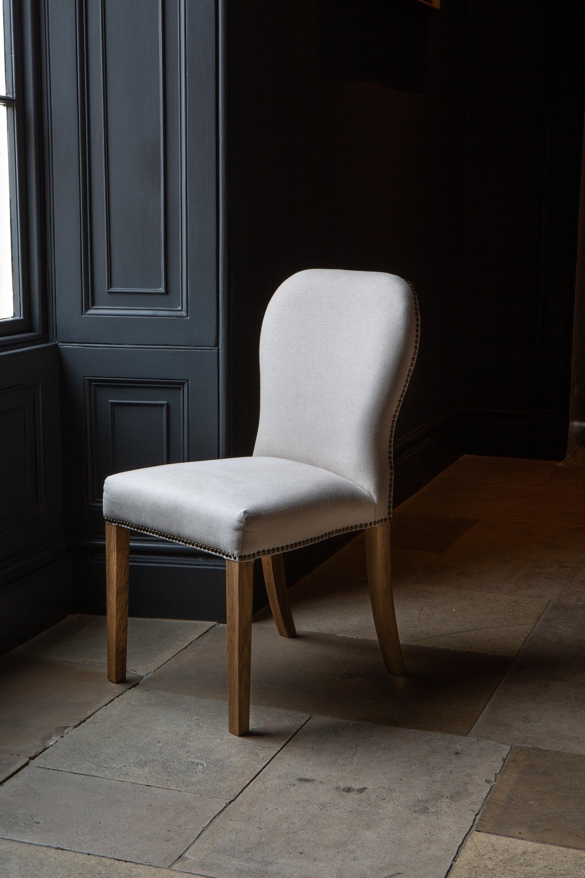 Carlton Furniture Pair of Pavilion Dining Chairs - Natural Linen Grey oil legs & Brass Studs — lifestyle setting