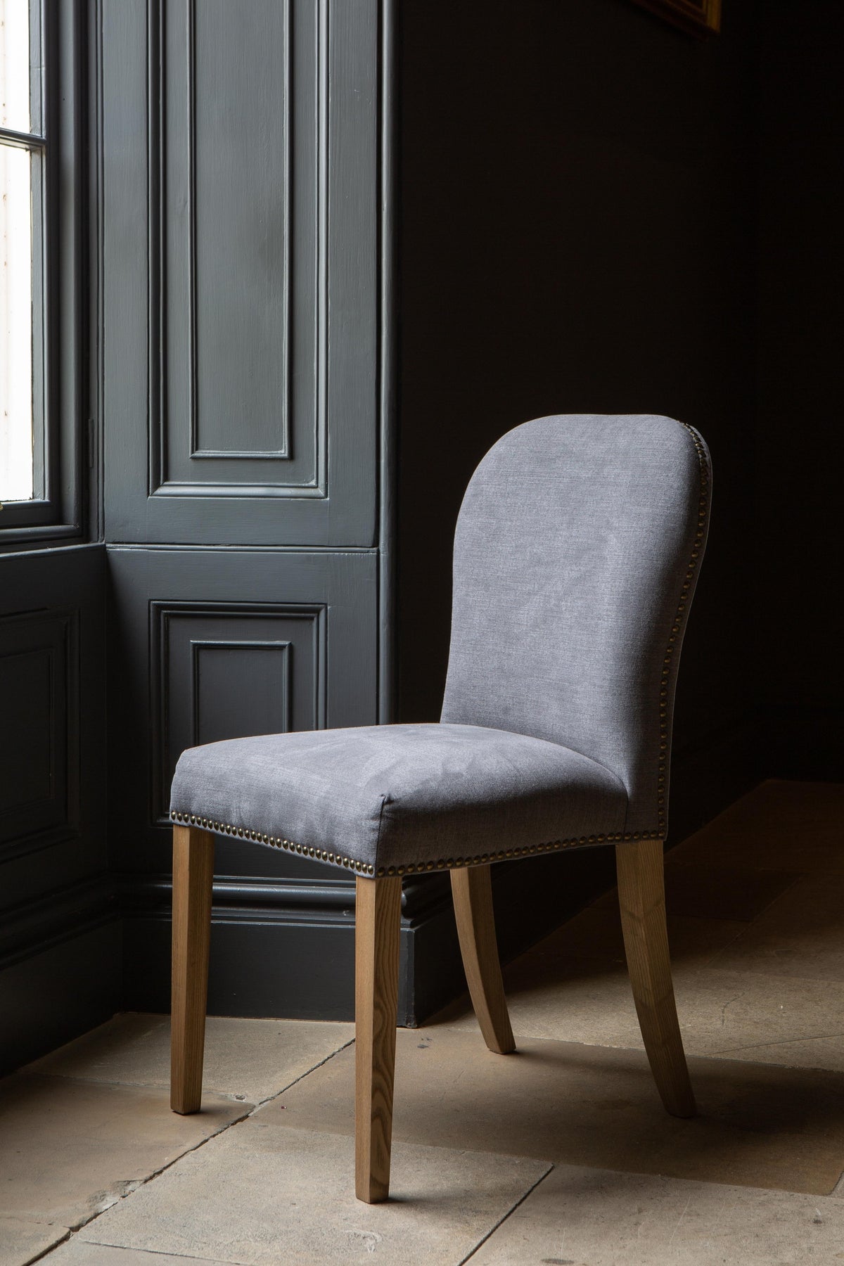 Carlton Furniture Pair of Pavilion Dining Chairs - Smoke with Grey oil legs & Brass Studs — lifestyle setting