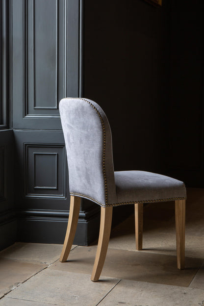 Carlton Furniture Pair of Pavilion Dining Chairs - Smoke with Grey oil legs & Brass Studs — lifestyle setting