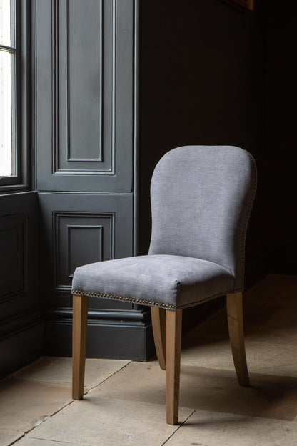 Carlton Furniture Pair of Pavilion Dining Chairs - Smoke with Grey oil legs & Brass Studs — lifestyle setting