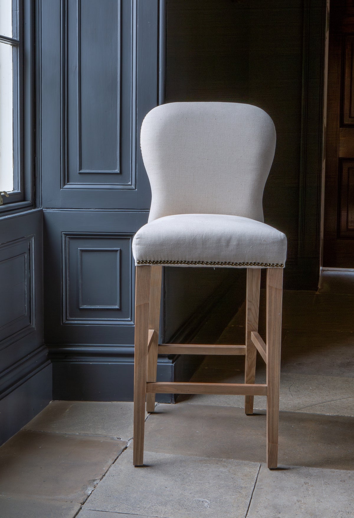 Carlton Furniture Pavilion Barstool - Natural Linen Grey oil legs & Brass Studs — lifestyle setting