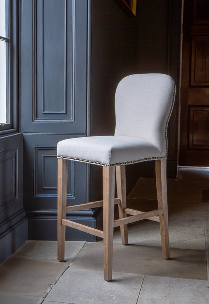 Carlton Furniture Pavilion Barstool - Natural Linen Grey oil legs & Brass Studs — lifestyle setting