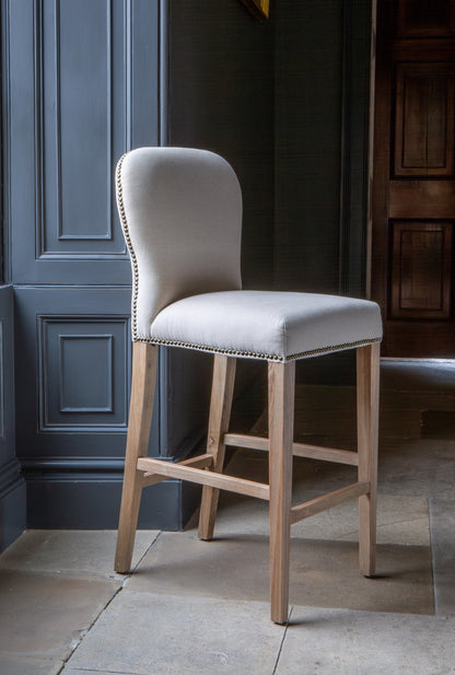 Carlton Furniture Pavilion Barstool - Natural Linen Grey oil legs & Brass Studs — lifestyle setting