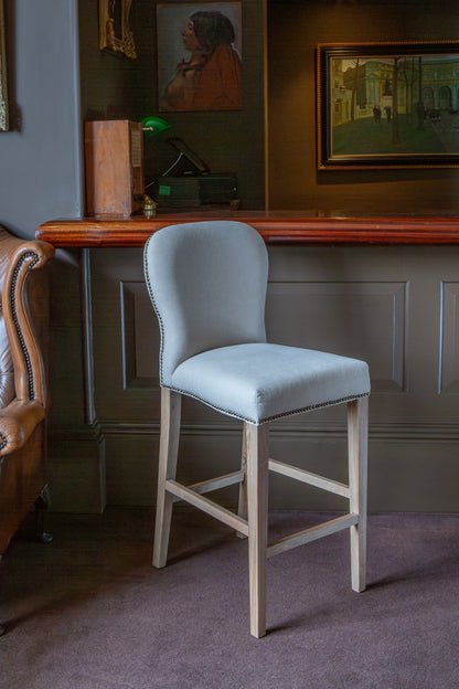 Carlton Furniture Pavilion Barstool - Natural Linen Grey oil legs & Brass Studs — lifestyle setting