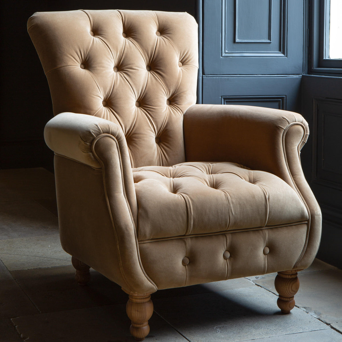 Carlton Furniture Westminster Armchair in Butterscotch Velvet - room view showing butterscotch velvet high back and turned feet