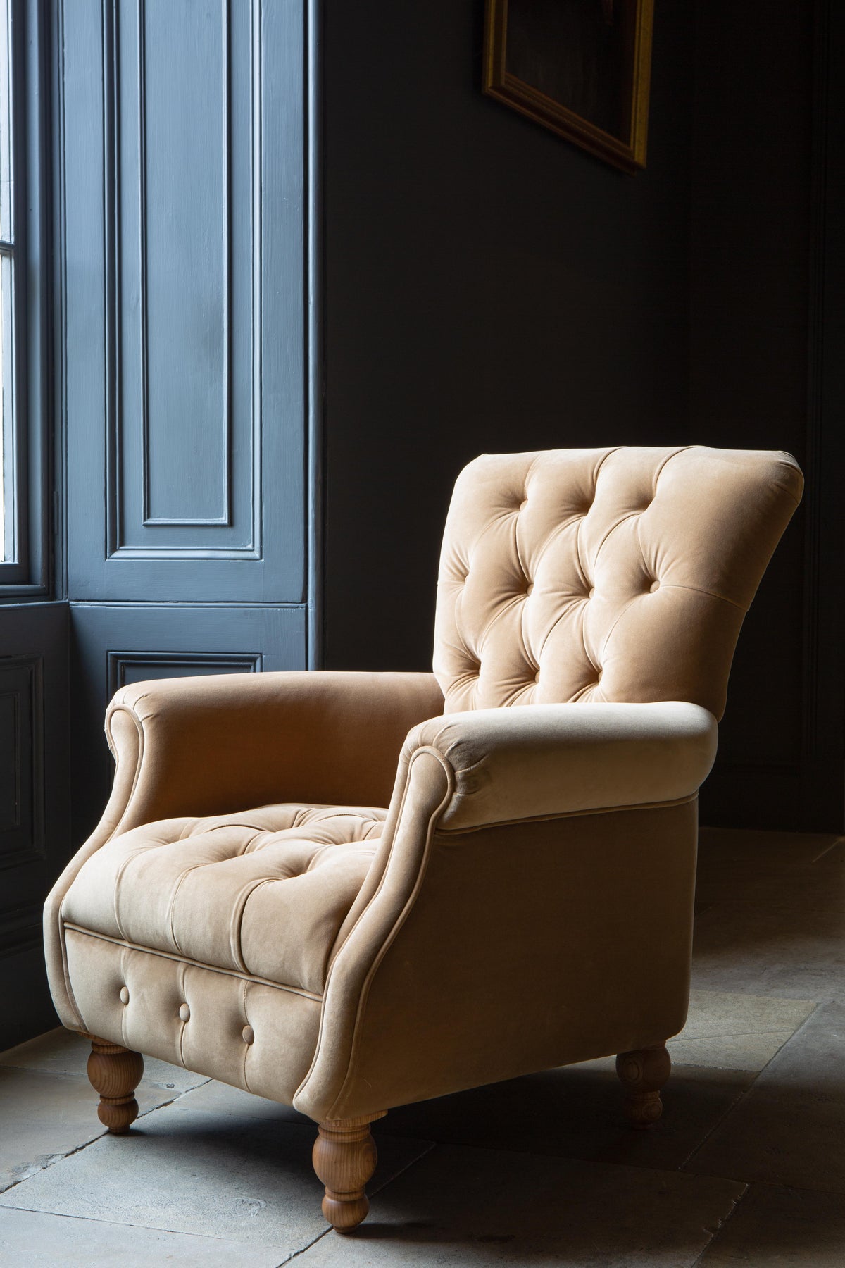 Carlton Furniture Westminster Armchair in Butterscotch Velvet - room view showing butterscotch velvet high back and turned feet