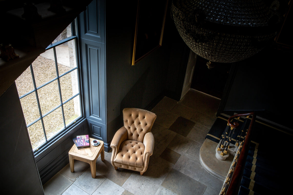 Carlton Furniture Westminster Armchair in Butterscotch Velvet - overhead room view of buttoned seat and rolled arms