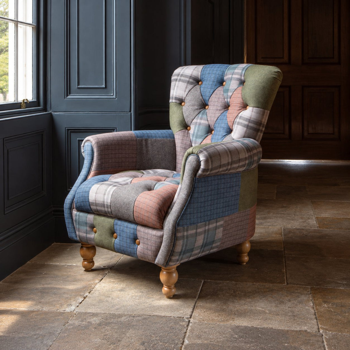Carlton Furniture Westminster Armchair in Patchwork with Natural Legs - angled room view of patchwork armchair and natural turned feet