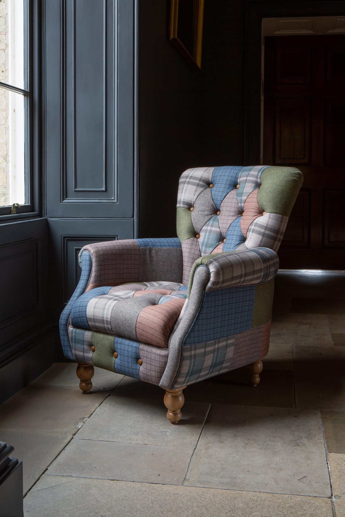 Carlton Furniture Westminster Armchair in Patchwork with Natural Legs - angled room view of patchwork armchair and natural turned feet
