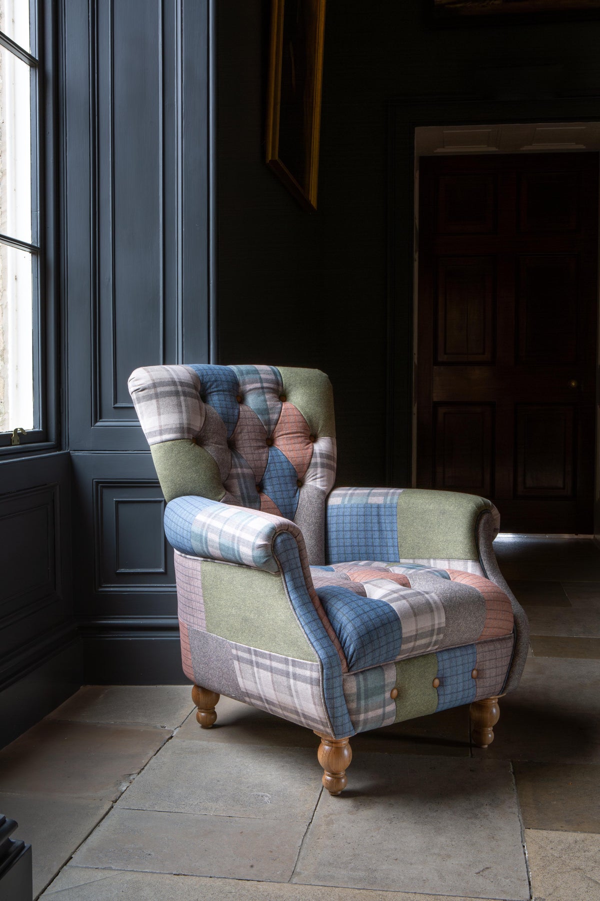 Carlton Furniture Westminster Armchair in Patchwork with Natural Legs - angled room view of patchwork armchair and natural turned feet