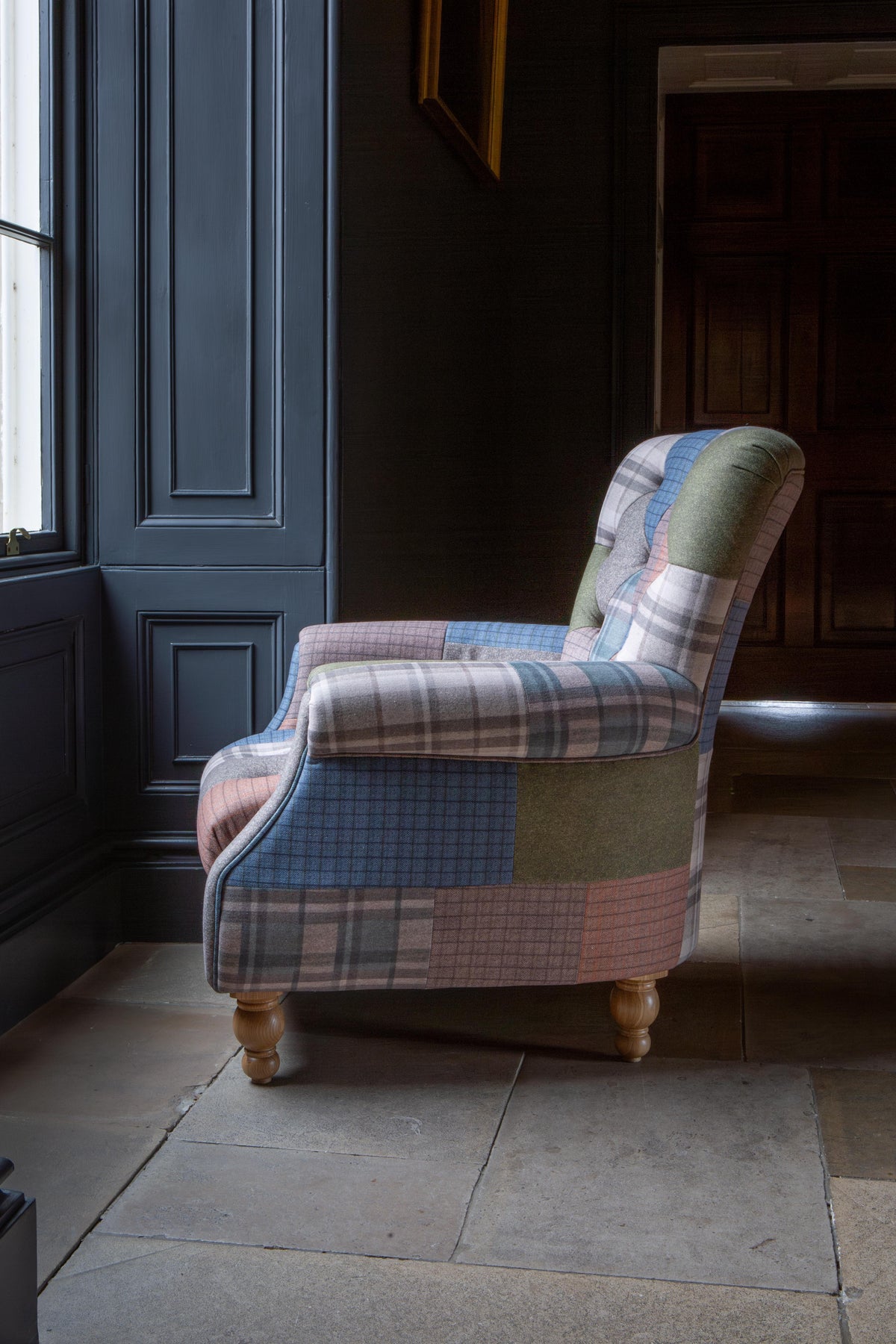 Carlton Furniture Westminster Armchair in Patchwork with Natural Legs - side room view of patchwork chair and rolled arm