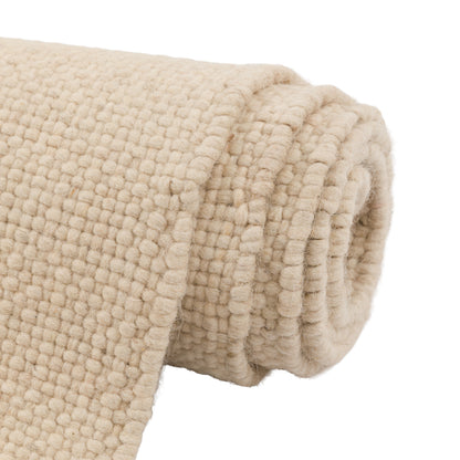 Gallery Direct Amara Rug Cream - rolled rug showing weave and pile texture