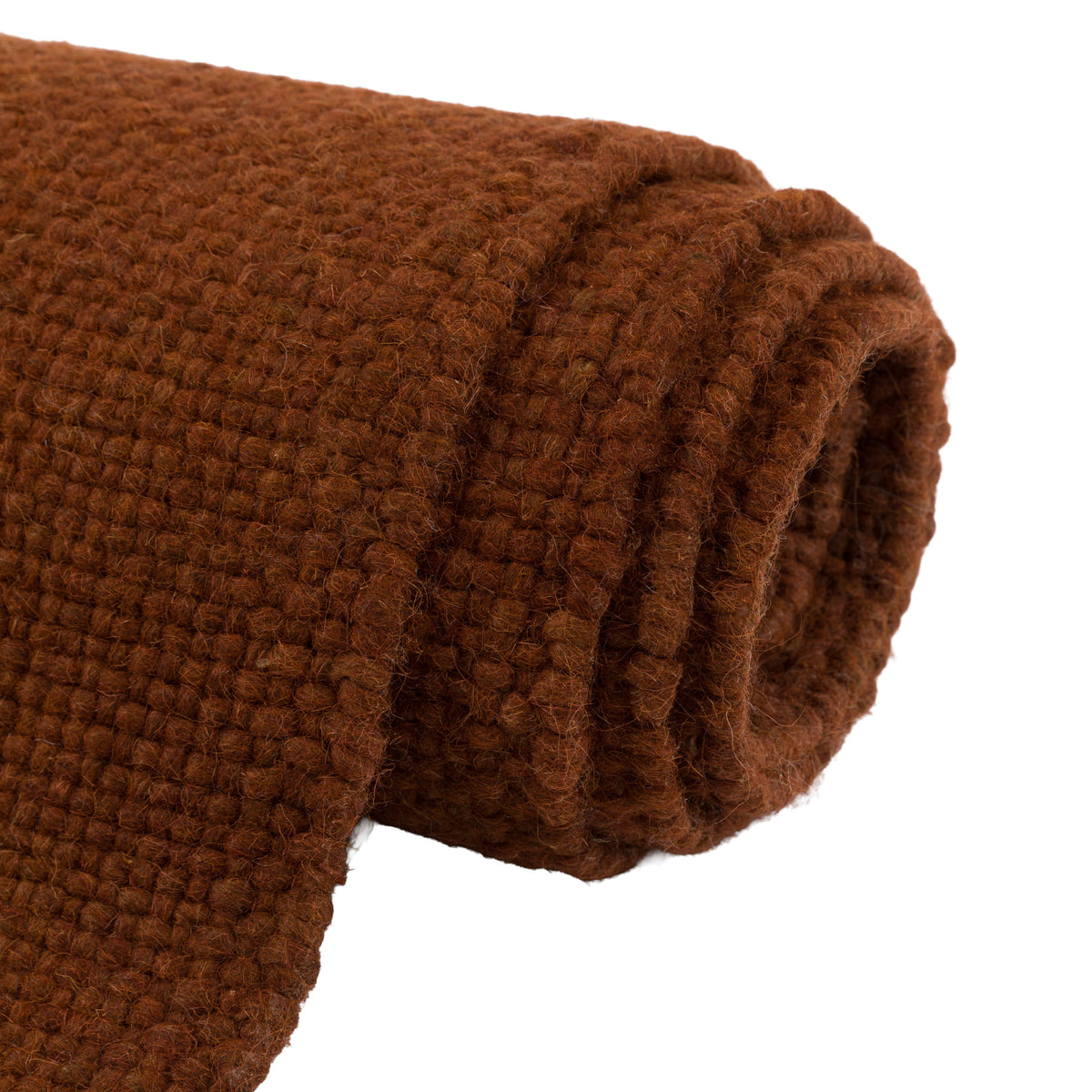 Gallery Direct Amara Rug Rust - rolled rug showing weave and pile texture