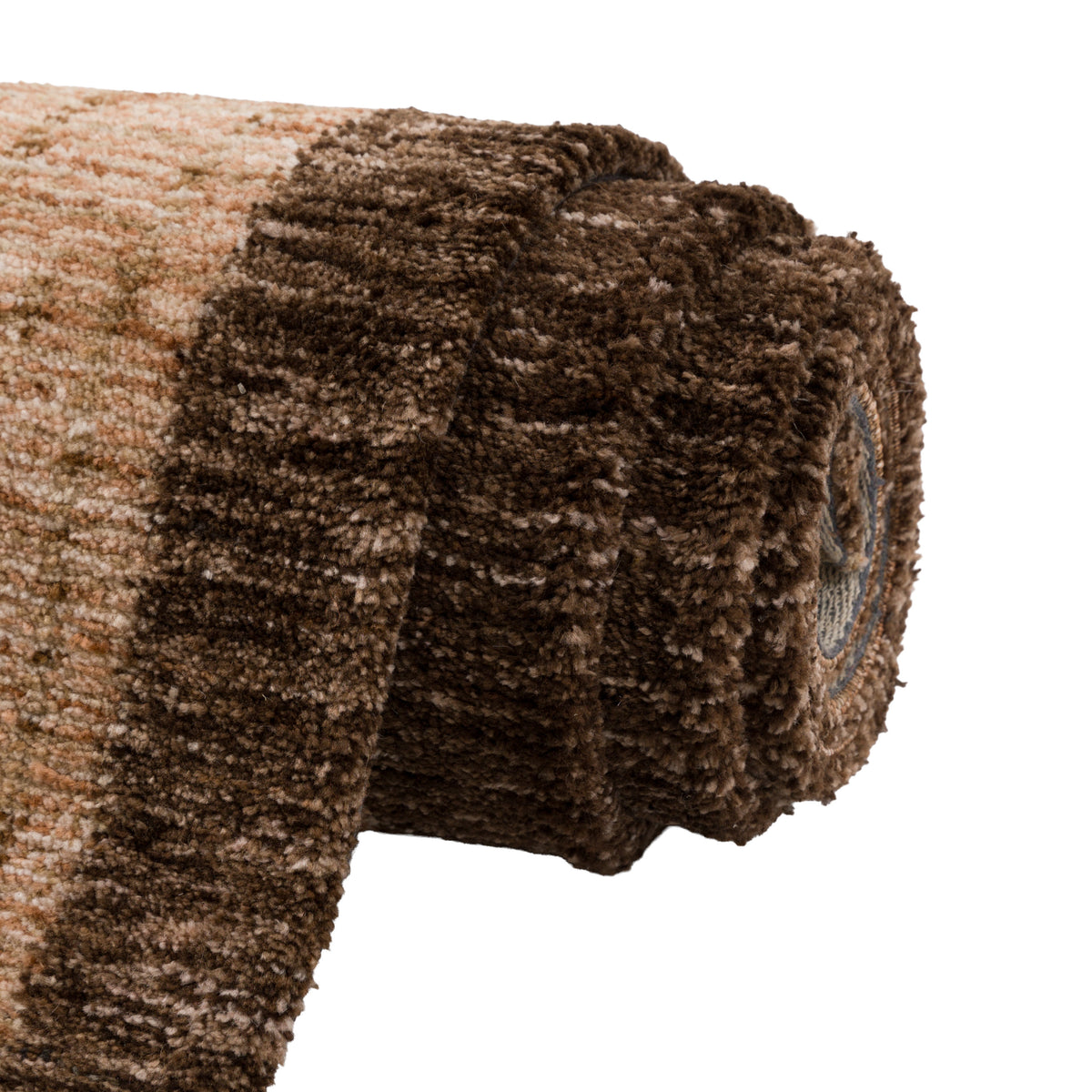 Gallery Direct Amica Rug Tan - rolled rug showing weave and pile texture