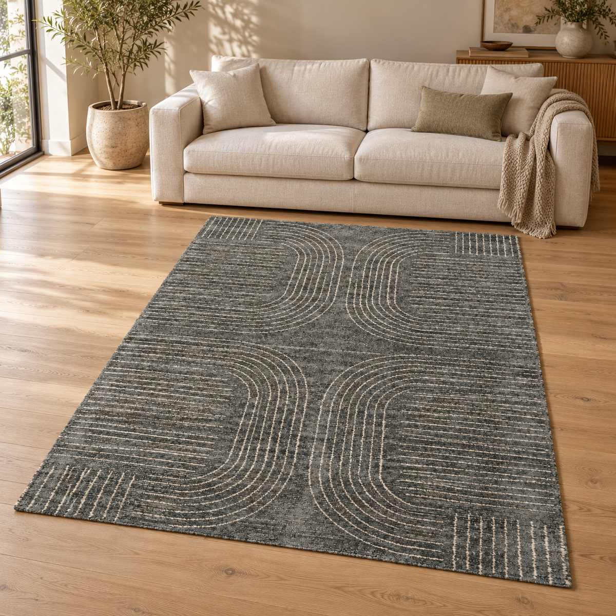 Gallery Direct Azelo Geo Rug Graphite styled in a neutral living room; complete rug visible