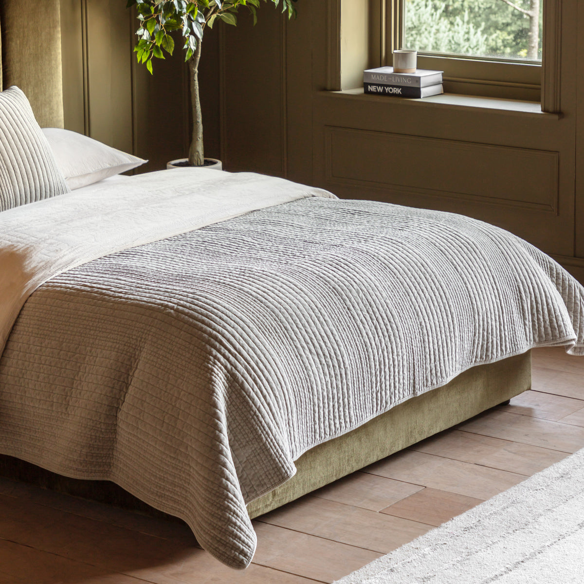 Gallery Direct Cotton Velvet Stitched Bedspread Taupe 2200x2400mm - styled across a bed in a bedroom