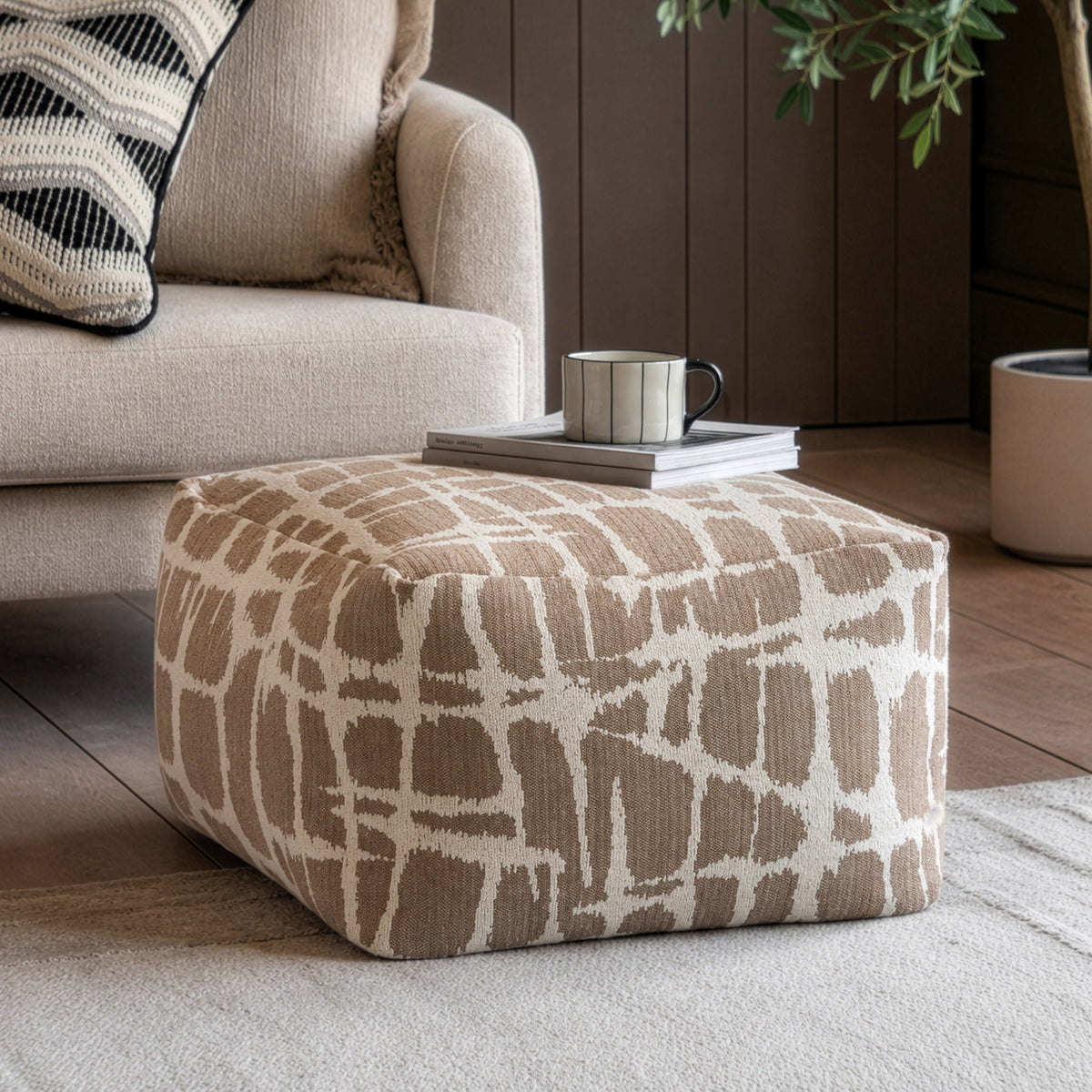 Gallery Direct Elara Jacquard Pouffe Mocha 550x550x350mm - styled beside a sofa