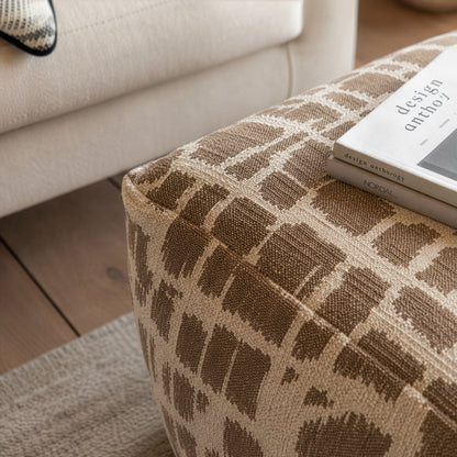 Gallery Direct Elara Jacquard Pouffe Mocha 550x550x350mm - jacquard upholstery detail beside a sofa