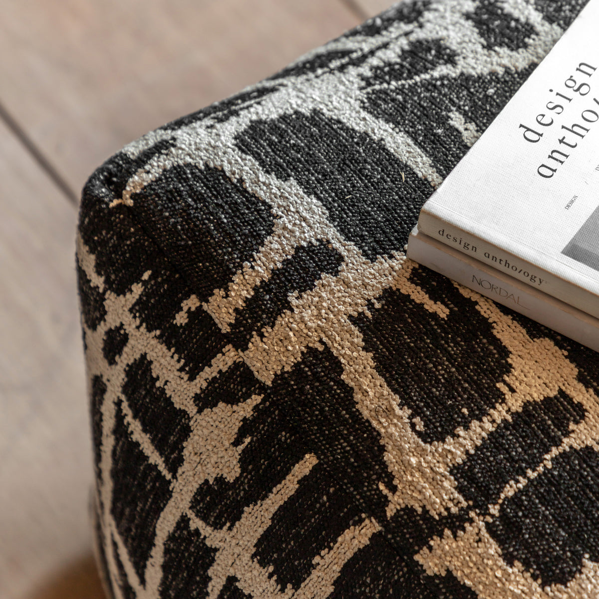 Gallery Direct Elara Jacquard Pouffe Slate 550x550x350mm - jacquard upholstery detail beside a sofa