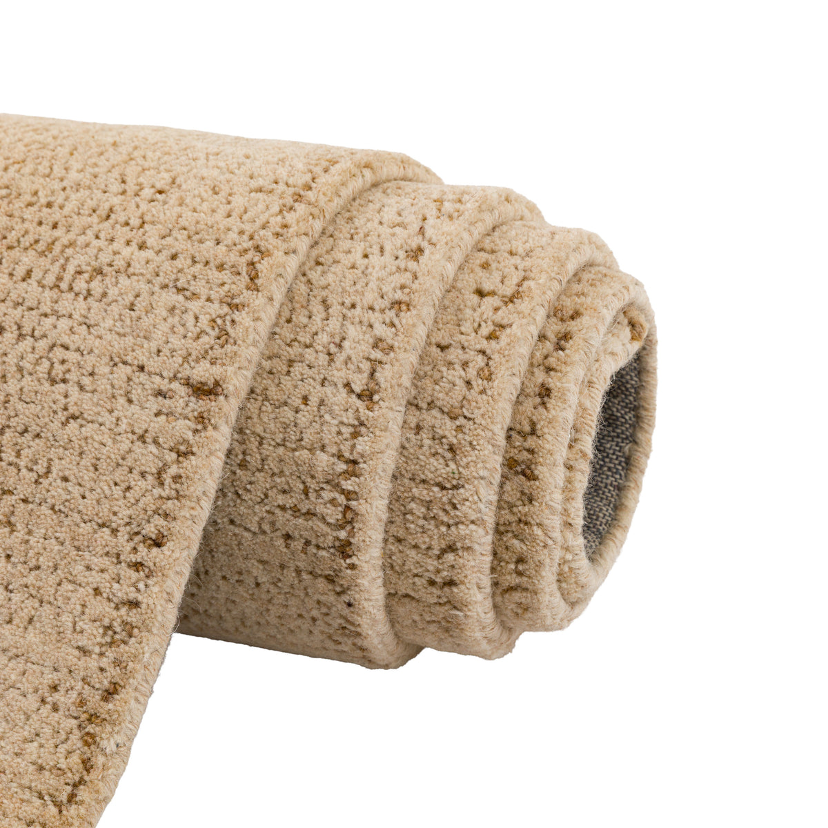 Gallery Direct Elara Rug Sand - rolled rug showing weave and pile texture