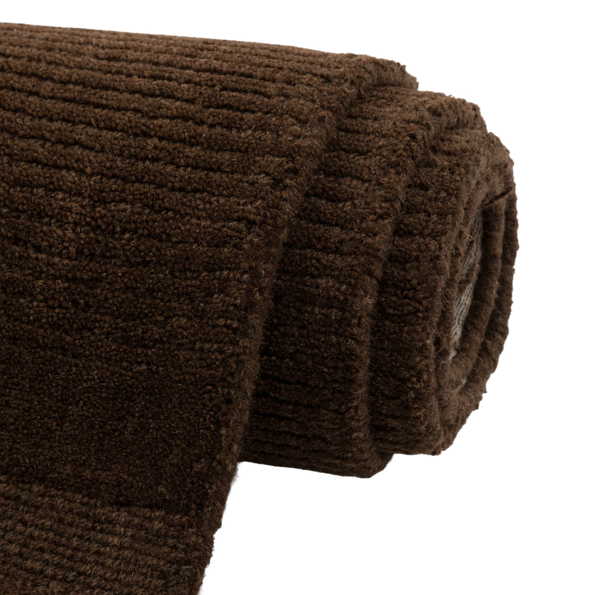 Gallery Direct Malin Rug Chocolate - rolled rug showing weave and pile texture