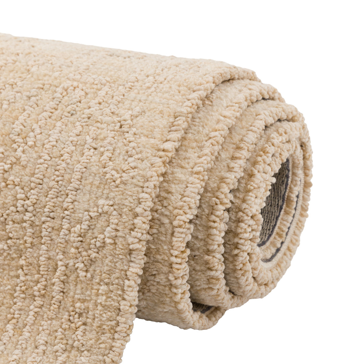 Gallery Direct Orla Rug Cream - rolled rug showing weave and pile texture