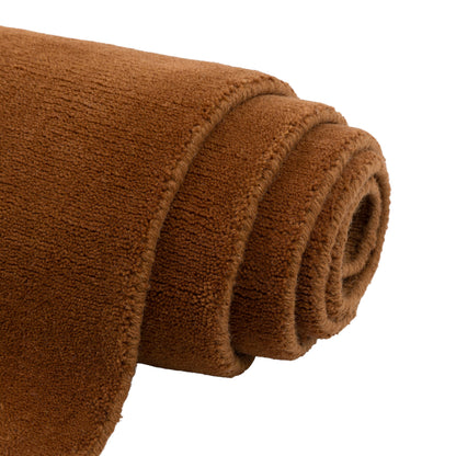Gallery Direct Sienna Rug Terracotta - rolled rug showing weave and pile texture