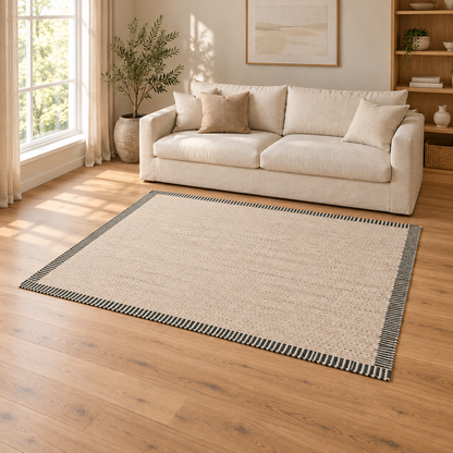 Gallery Direct Valena Border Rug Ecru styled in a neutral living room; complete rug visible